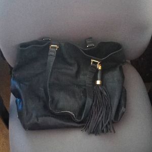 Black Steve Madden purse with tassel